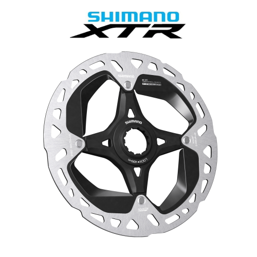 Shimano XTR/Dura Ace RT-MT900 bromsskiva, centrerad och i fokus, framhävd av stark belysning som accentuerar de silverfärgade och svarta detaljerna samt den tekniska designen mot en ren, vit bakgrund.