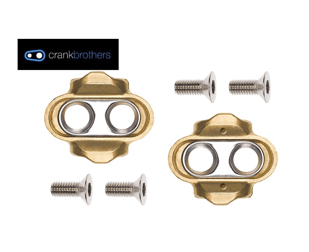 crankbrothers-silverguld-klipps-6-grader.png Två Crankbrothers pedalklossar i mässing och silver med tillhörande skruvar, presenterade mot en vit bakgrund. Studioljus framhäver detaljerna och den sex graders rörligheten.