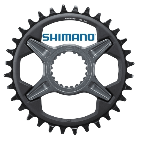 Shimano SLX SM-CRM75 framdrev i detalj, med fokus på drevens utformning och Shimano-logotypen. Gråskaliga toner och skarp belysning framhäver de fina detaljerna på cykelkomponenten.
