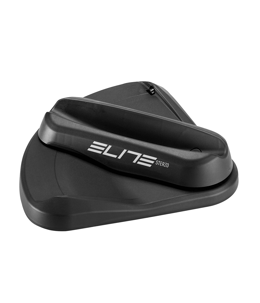 elite.styrplatta.mekanisk.png En mekanisk styrplatta för framhjul, Elite Sterzo, i svart plast, belyst med studioljus mot en vit bakgrund. Logotypen "Elite Sterzo" syns tydligt.