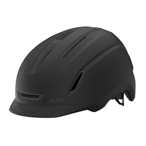 Den mattsvarta Giro Caden Mips II-hjälmen framhävs i starkt ljus, vilket betonar dess strömlinjeformade design och ventilationsöppningar. Hjälmen är både säker och stilren för cyklister.
