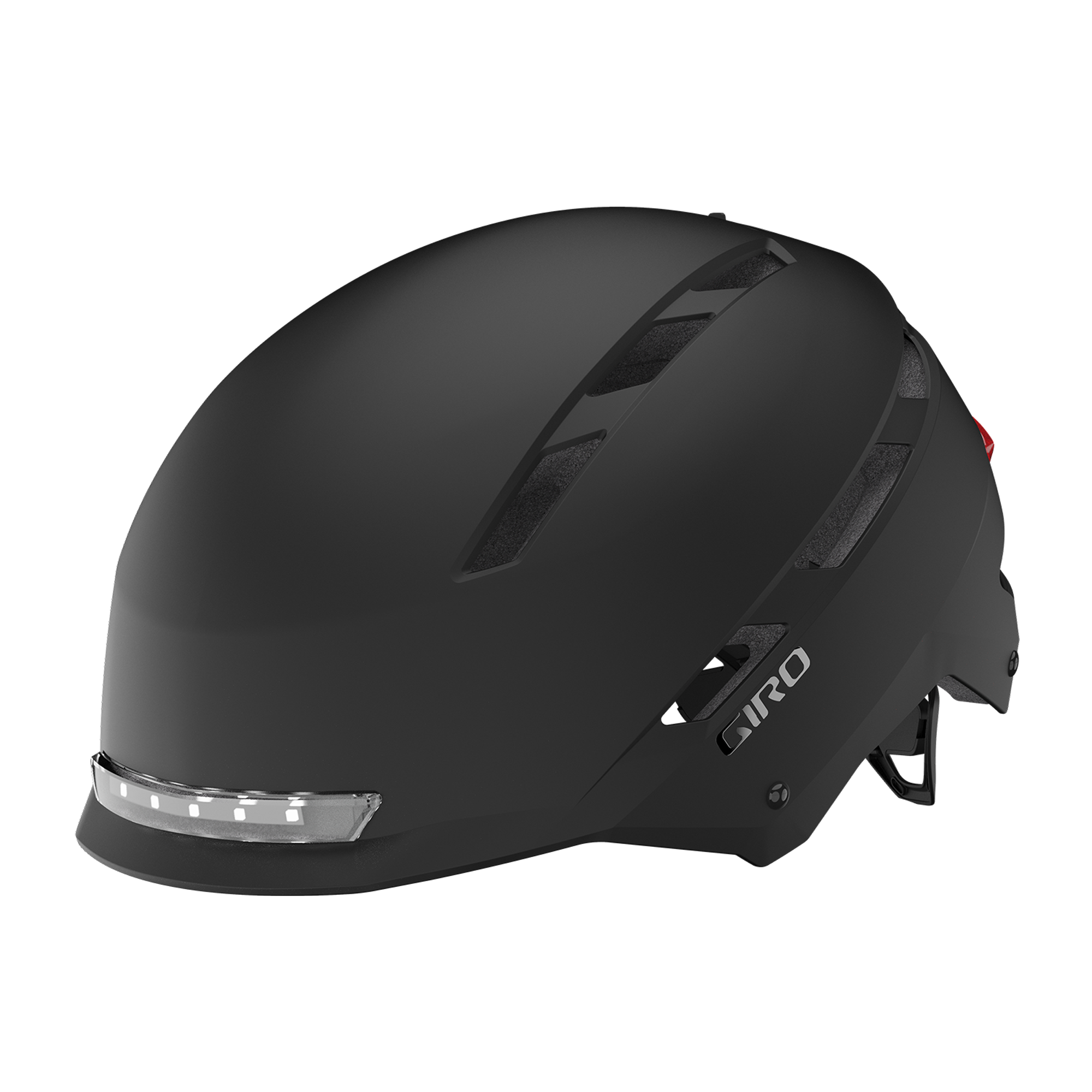 giro-escape-mips-urban-helmet-matte-black-hero Svart Giro Escape MIPS-hjälm med integrerad fram- och bakbelysning. Hjälmen är av urban design med ventilationsöppningar och Giros logotyp på sidan. Stämningsfullt ljus framhäver detaljerna.