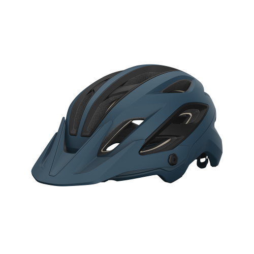 En blå Giro Merit Spherical MIPS-cykelhjälm visas i detalj. Ljuset framhäver designen och de många ventilationshålen. Hjälmen har en avtagbar skärm och tydliga MIPS-funktioner.