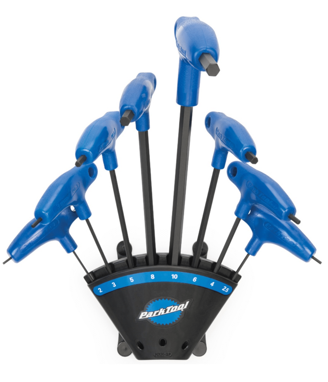 insecx-set.png Park Tool P-handled insexnyckelsats med hållare, presenterad i studioljus. Verktygen står upprätt i en svart hållare med blå detaljer och vita storleksmarkeringar.