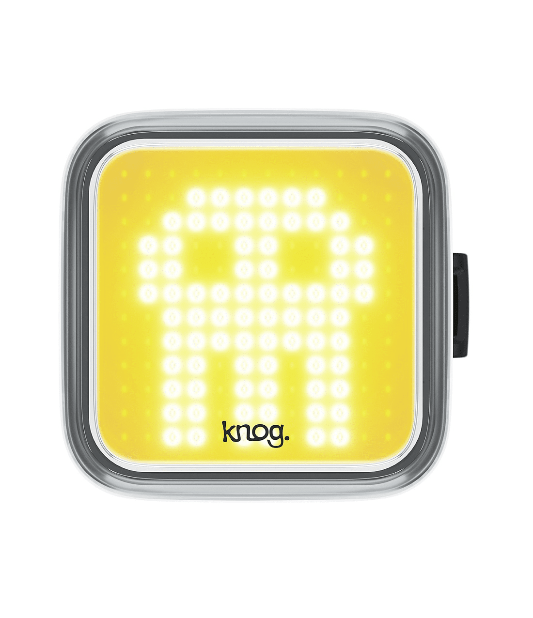knog.blinder.skull_.fram_.png Framlampa Knog Blinder Skull är en fyrkantig cykellampa med gult ansikte och ett vitt pixelerat spökmönster. Varumärket "knog." visas längst ner i mitten.