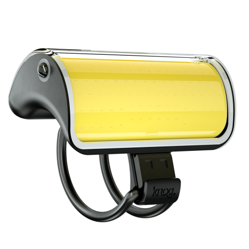 En närbild av Framlampa Knog Mid Cobber 320 lumen, en modern rektangulär cykelstrålkastare med en gul LED-panel, svart monteringsfäste märkt "Knog" och en elegant böjd design.