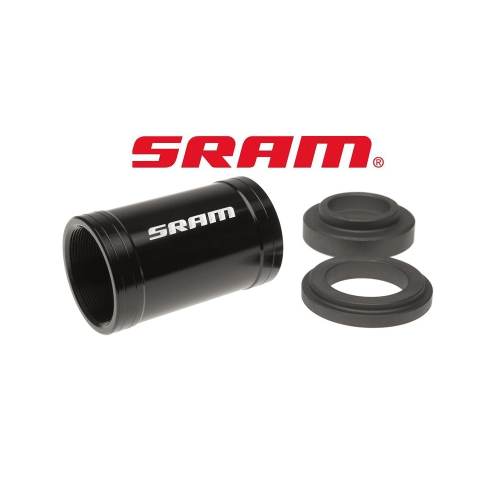 Detaljerad bild av en svart Ramadapter Sram BB30 till BSA-gänga tillsammans med två distansringar, under bra ljus med skärpa på produktdetaljerna.