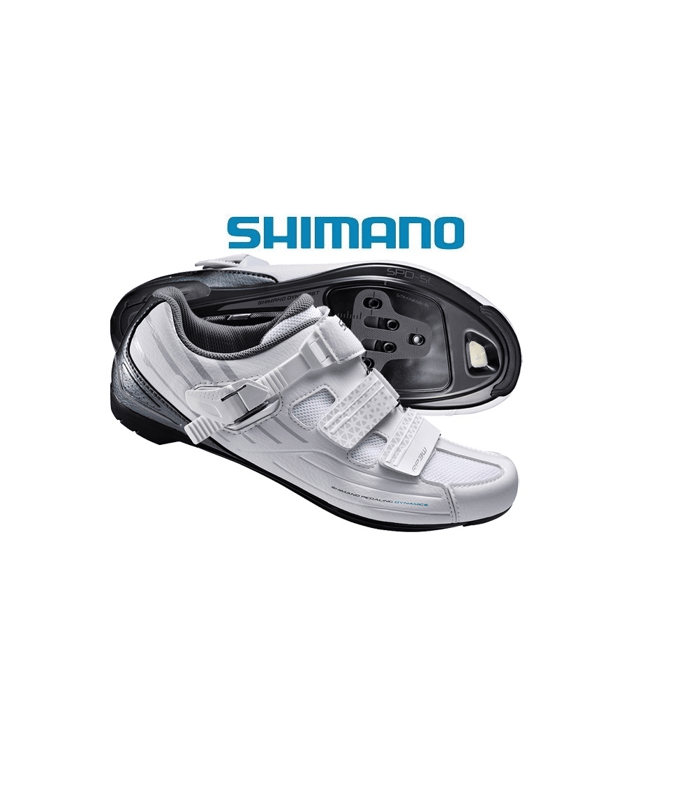 shimano.rp300.vit_.png Shimano-logotypen visas ovanför ett par vita Landsvägssko Shimano SH-RP3 Dam cykelskor, en upprätt och en på sidan för att visa sulan med fästpunkter för klossar.