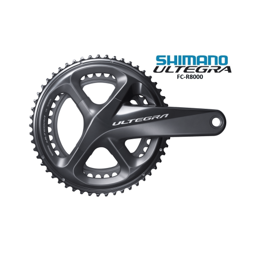 Detaljerad bild av ett Shimano Ultegra FC-R8000 vevparti, 52/36T, designat för 2x11-växlade system. Silvergrå finish framhävs av stark belysning, betonar dess exakta konstruktion och aerodynamiska form.