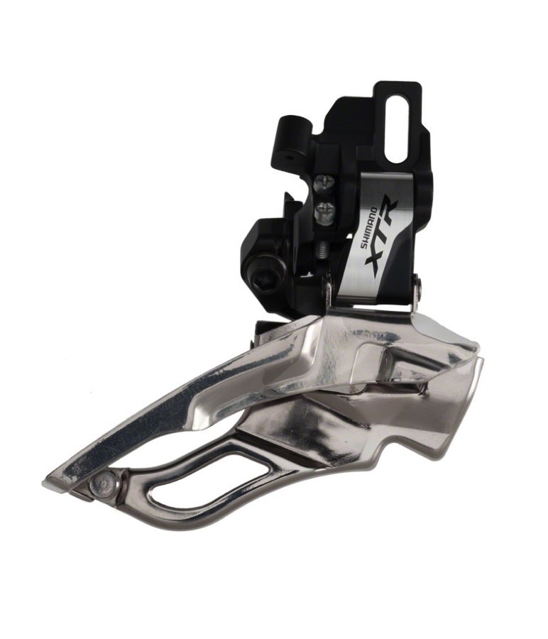 Shimano-FD-M981-D Framväxel Shimano XTR FD-M981 i silver och svart. Produktfotografering med stark belysning som framhäver detaljerna och den metalliska finishen. Avsedd för 3x10-växlade cyklar.