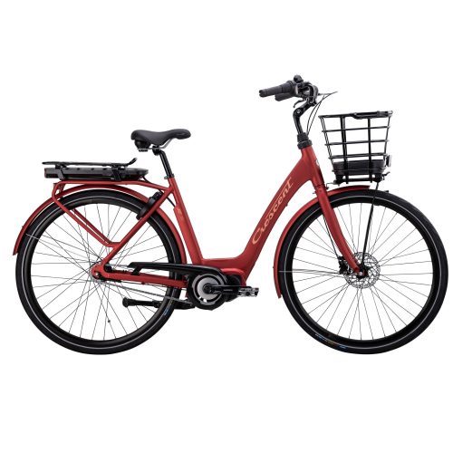 El-cykel Crescent Elsa 7s, Röd är en röd genomgående elcykel med korg fram, pakethållare bak, svart styre och svart sadel, fotograferad i sidoprofil mot en vit bakgrund.
