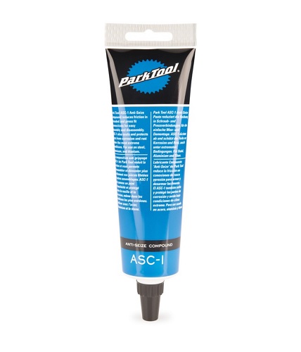 En tub Park Tool Anti-Seize ASC-1 monteringspasta står mot en vit bakgrund. Tuben har mörkblå detaljer och texten "ANTI-SEIZE COMPOUND ASC-1" är tydligt synlig. Det hela är väl belyst och produkten framstår som ren och ny.