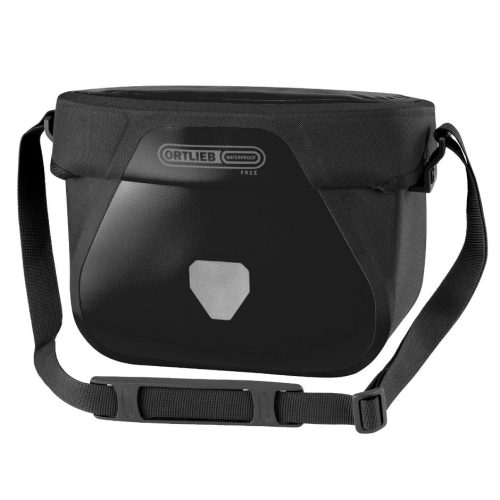 Svart Ortlieb Ultimate Free styrväska på 6,5 liter, perfekt för cykelturer. Väskan har justerbar axelrem och reflexdetaljer för ökad synlighet. Marken är vit.