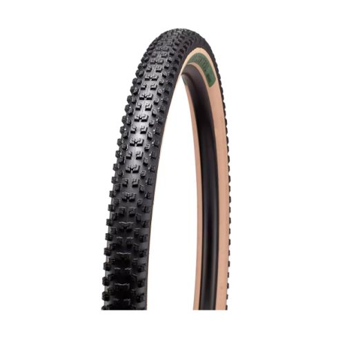 Detaljerat däck för mountainbike, Specialized Ground Control, visar robust mönstring och beige sidovägg under studioljus, framhävande dess terrängkapacitet och moderna estetik.