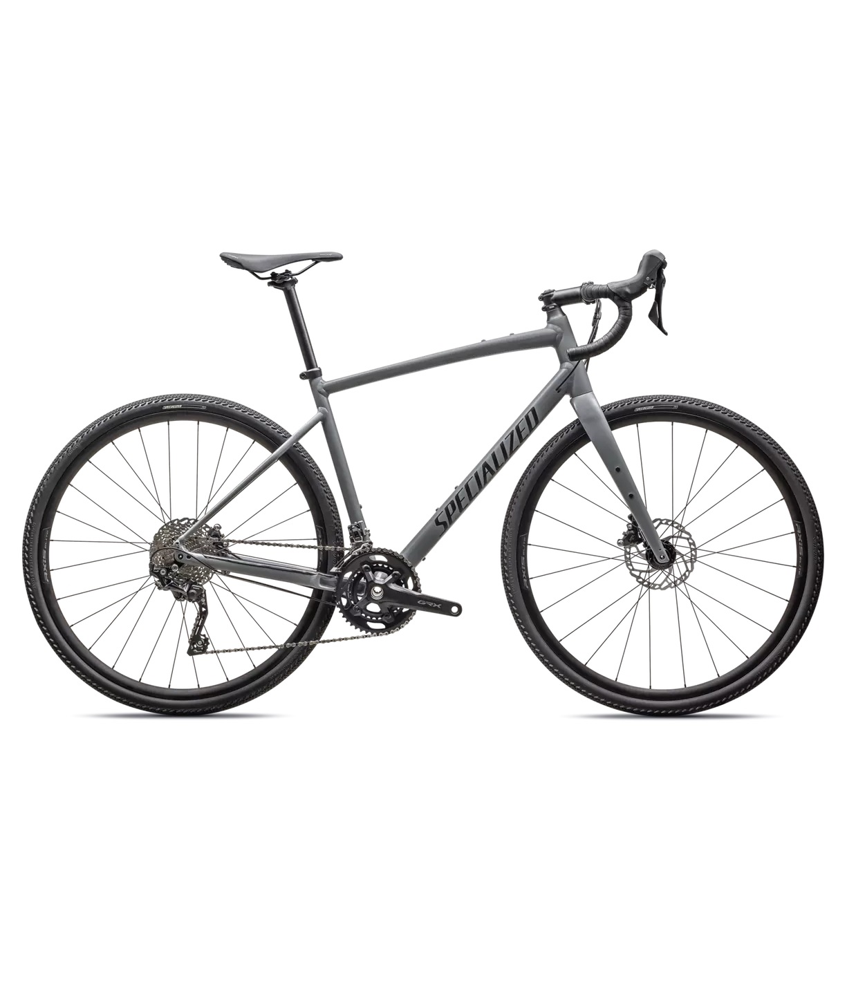 DIVERGE-E5-ELITE-ASHGRY-OBSD-25 Grå Specialized Diverge Elite E5 gravelcykel i detalj, med fokus på den matta lacken och däckens mönster. Välbelyst bild som framhäver cykelns design.
