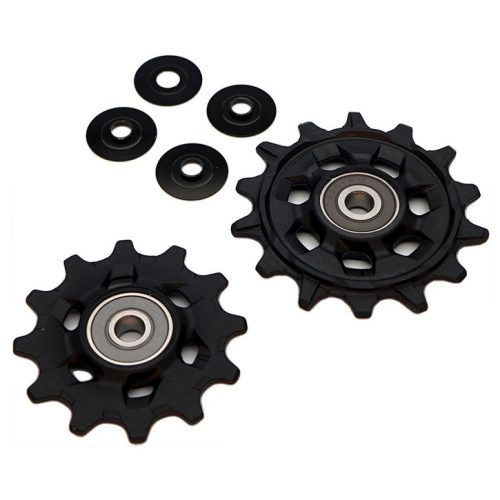 Svarta rulltrissor Sram Eagle GX (X01, XX1) 1x12-vxl, med lager och brickor, presenterade i detalj mot en ljus bakgrund med jämn belysning som framhäver deras design och funktion.
