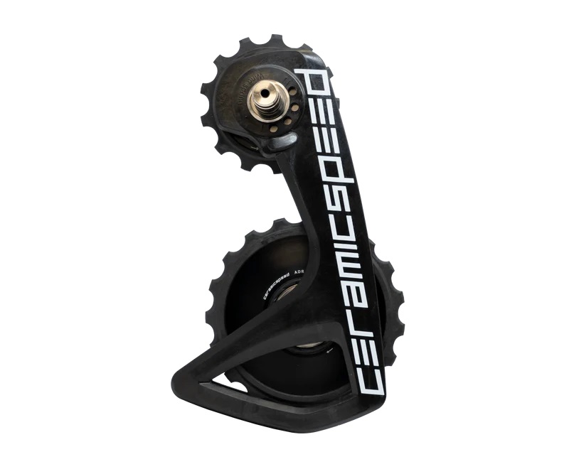 113491_b0b89438-bd14-47c2-818d-bfc8c0305c27 Ceramicspeed OSPW RS ALPHA TEAM växel med två svarta kugghjul och vit text.
