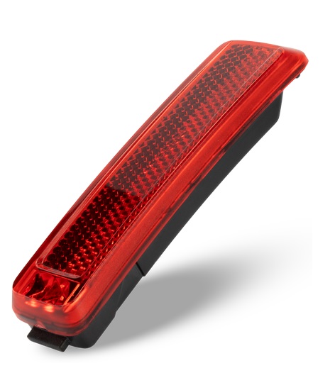 Acid-Pro-E-SIC-2-0 Baklampa ACID E-Bike PRO-E Sic 2.0 bromsljus BES3 för bakskärm är en röd och svart rektangulär bilreflektor i plast med en strukturerad reflekterande yta, som visas mot en vit bakgrund och kastar en svag skugga.