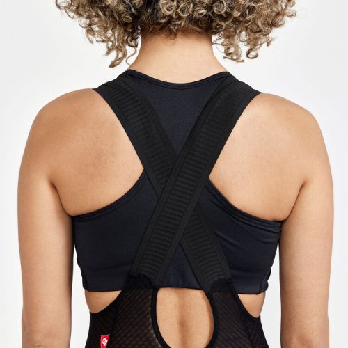 ADV Gravel Bib Shorts dam, bakifrån, med korsade band och nätmaterial.