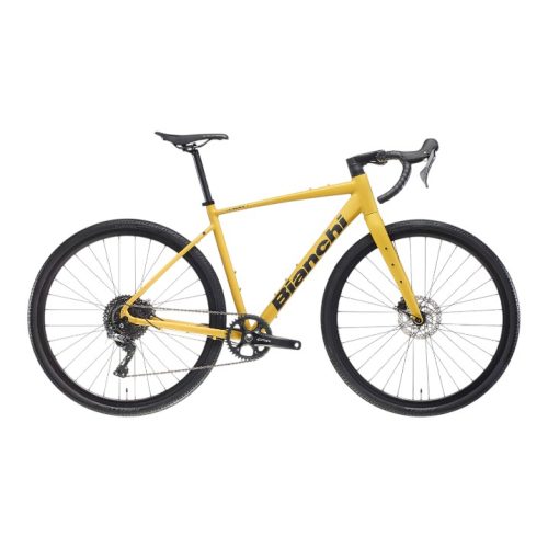 En Racer Bianchi Nirone 7 Disc GRX, 1x12s i gult med droppstyre, skivbromsar, svarta hjul och en svart sadel visas från sidan mot en vit bakgrund.