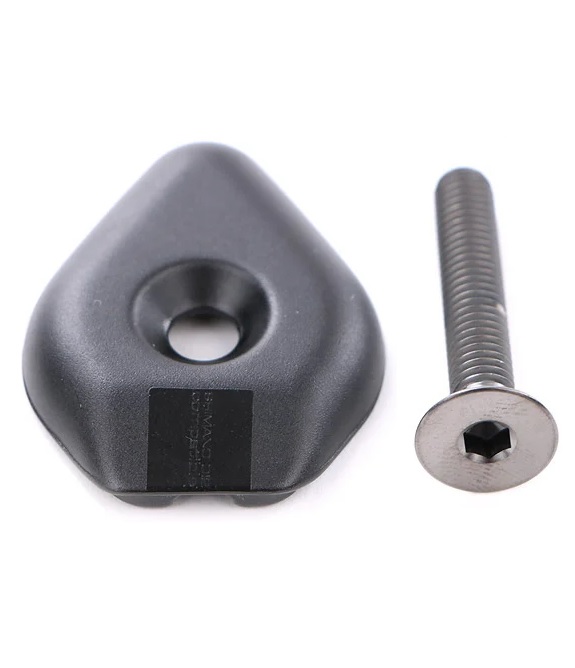 Pro-topcap-Vibe Topcap PRO 1 1/8 Aluminium för Vibe styrstam, en svart triangulär metallplatta med ett hål i mitten, visas tillsammans med en silverfärgad insexskruv med platt huvud mot en vit bakgrund.