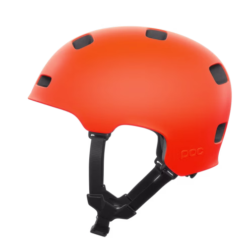 Barnhjälm POC Crane Mips – Flera färger (kopia) är en klarorange cykelhjälm med flera ventilationshål och ett justerbart svart hakband, avbildad mot en enfärgad vit bakgrund.